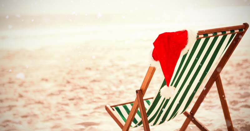Beach chair with a Santa hat.